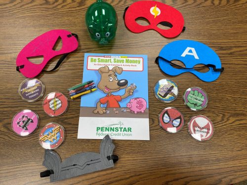 Pennstar Federal Credit Union's "Savings Superheroes" in-branch giveaways to engage younger members, including super hero masks, coloring books, and buttons.